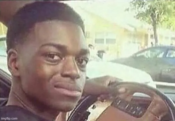 Ảnh người đàn ông da đen che trán lúng túng