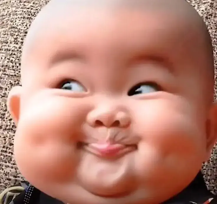 Khuôn mặt thằng cu cười cực đáng yêu.