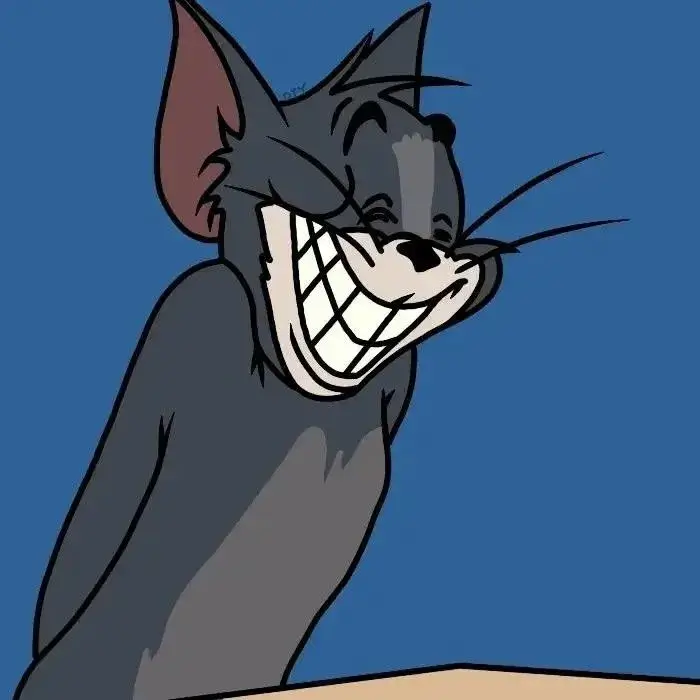 Meme Tom cười nhe răng