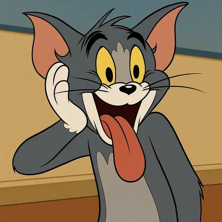 Meme Tom lè lưỡi cười nhe răng đầy tinh nghịch