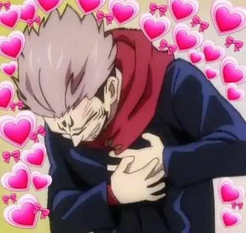 3 Chàng trai tóc hồng trong khung anime cúi nhẹ, một tay đặt trước ngực giữa nền tim nhỏ, áo tối màu khiến ảnh phản ứng sốc trông vẫn rất duyên