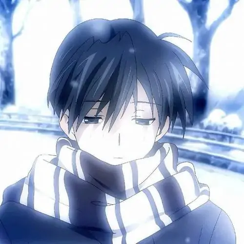 38 Cậu nam tóc xanh đen ngồi trong quán cà phê vắng, ngón tay chạm miệng cốc nóng, ánh nhìn rơi ra ô kính mưa tạo chất hoài niệm khá đẹp