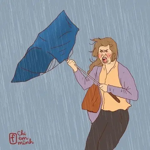 25 Chế ảnh người phụ nữ vật lộn với chiếc ô xanh trong cơn gió mạnh với mái tóc bay loạn xạ tạo nên một khoảnh khắc dở khóc dở cười.